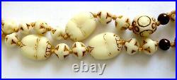 An Art Deco Czech Neiger Brothers Egyptian Cream Coloured Glass Necklace