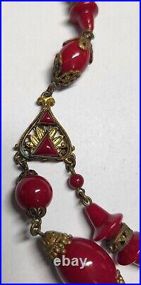 Antique Art Deco MAX NEIGER BROS sign Dark Red Glass Necklace Ornate Brass