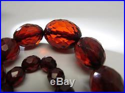Art Deco Era Faceted And Graduated 31-Inch Cherry Amber Bakelite Necklace